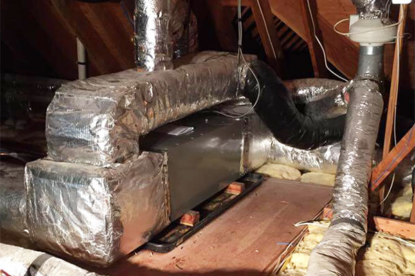 Insulation and ductwork installed in an attic