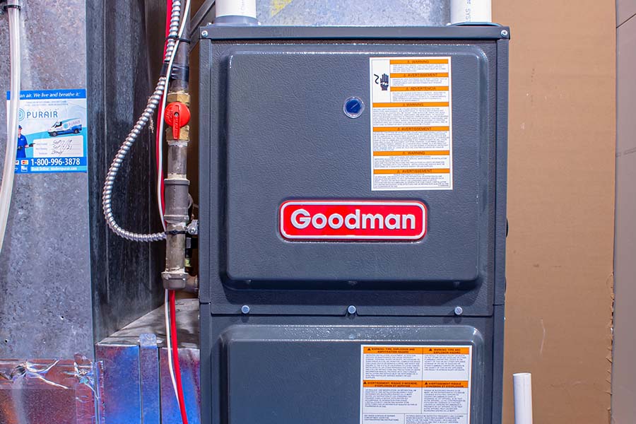 A Goodman furnace installed in a utility area