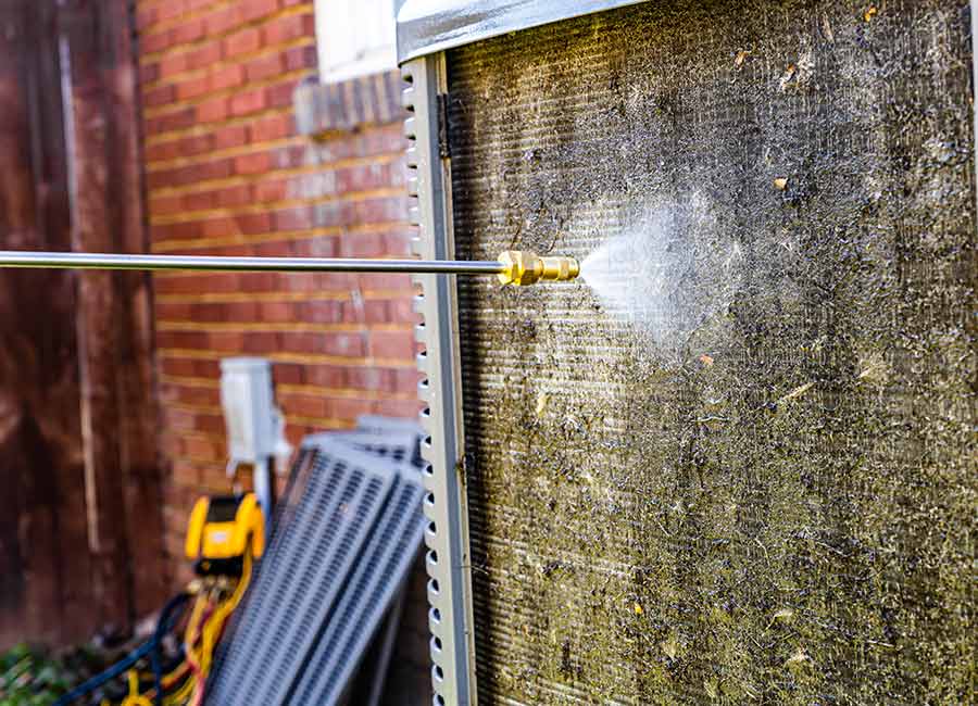 Power washing an outdoor AC unit